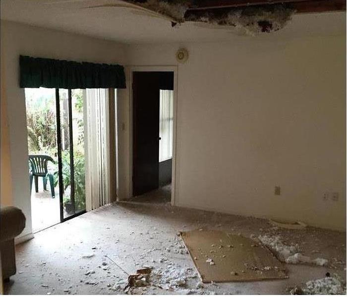 Ceiling and tile damage to a home in Kissimmee, FL